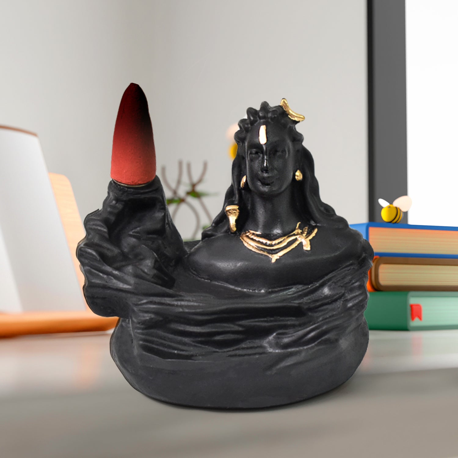 Adiyogi Shiva Backflow Incense Holder with smoke cascading downwards, creating a serene waterfall effect.