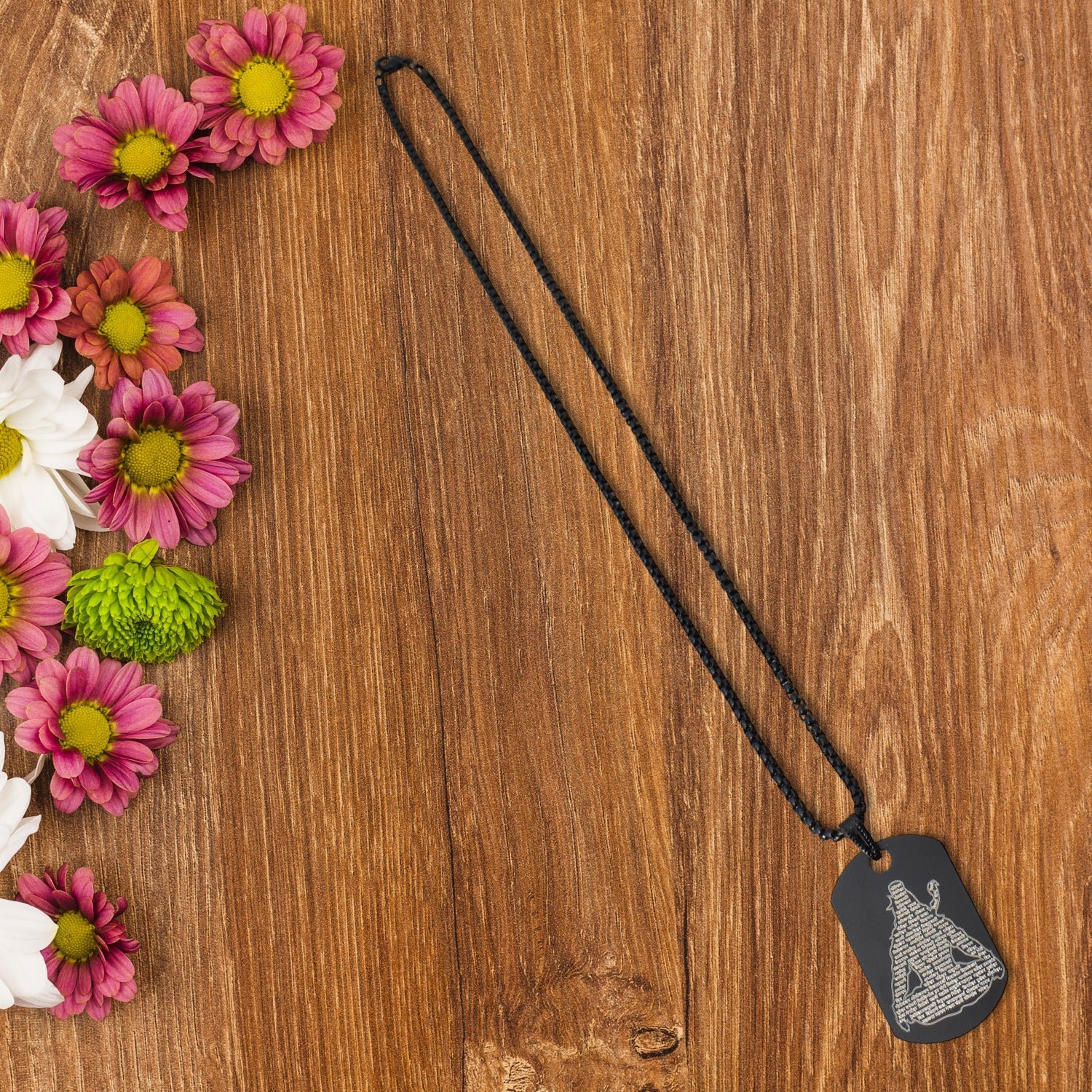 Mahadev Locket in stainless steel with intricate Shiva names engraving, displayed on a dark background.