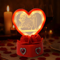Love Couple Showpiece featuring heart-shaped frame with red rose base