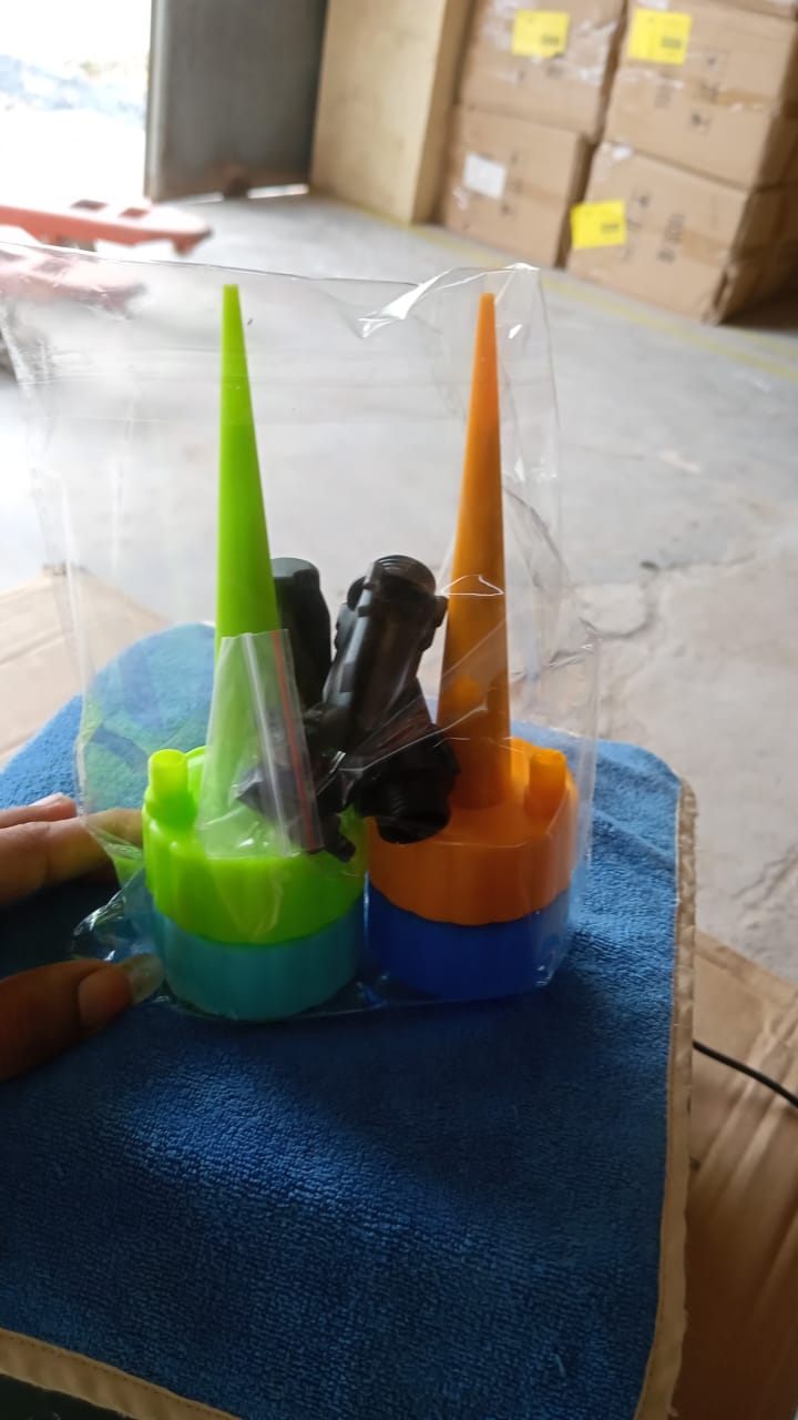 Self-Watering Spikes in use with various bottle sizes.