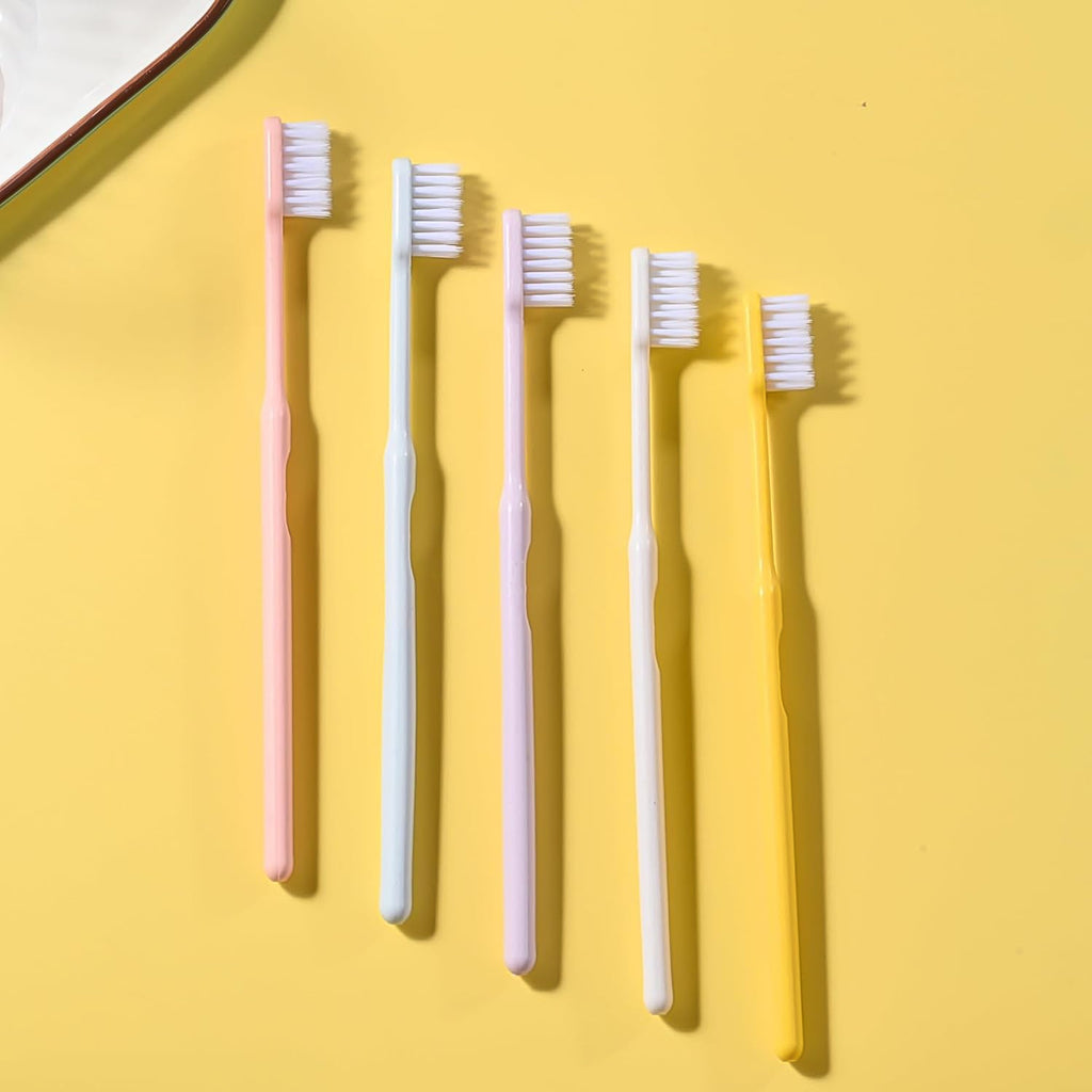 Arrangement of multicolor soft plastic toothbrushes, showcasing the variety in the family pack.