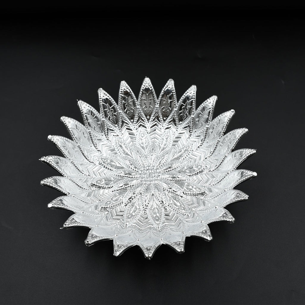 Multipurpose silver finish tray showcasing dry fruits, ideal for festive gatherings.
