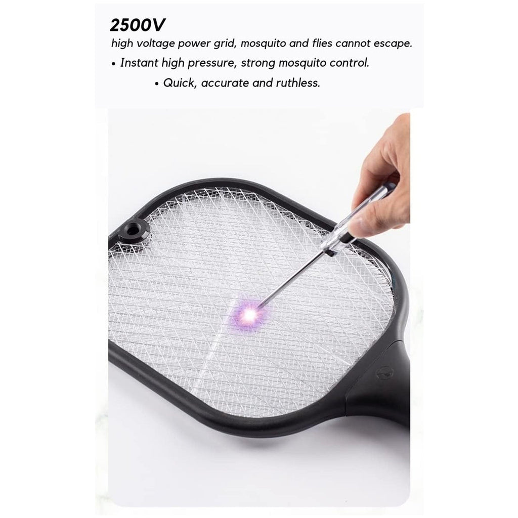 A hand uses a metal probe to demonstrate the purple light of the electric grid on a black mosquito killer racket.