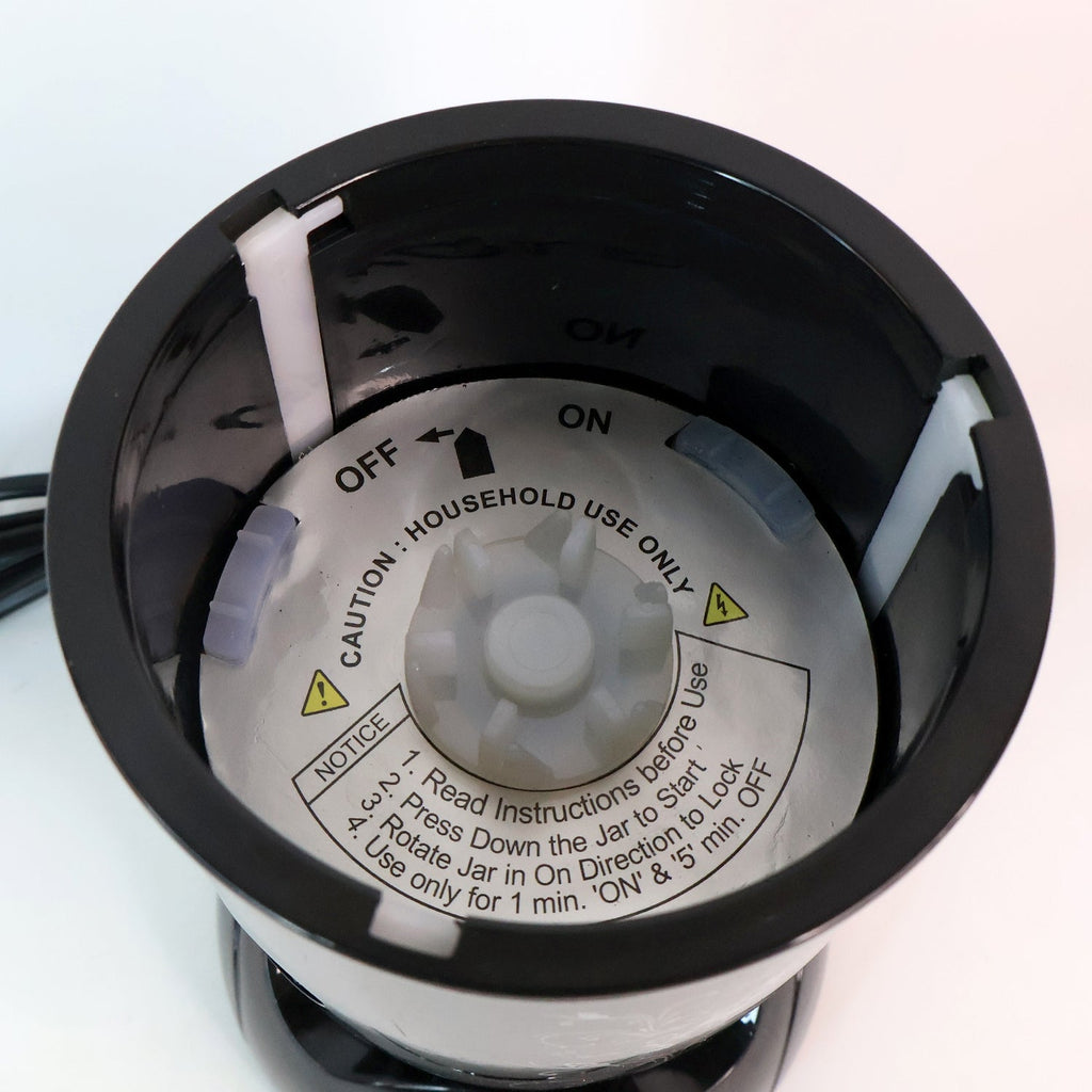 Close-up of stainless steel blades and jars of Orbit mixer grinder
