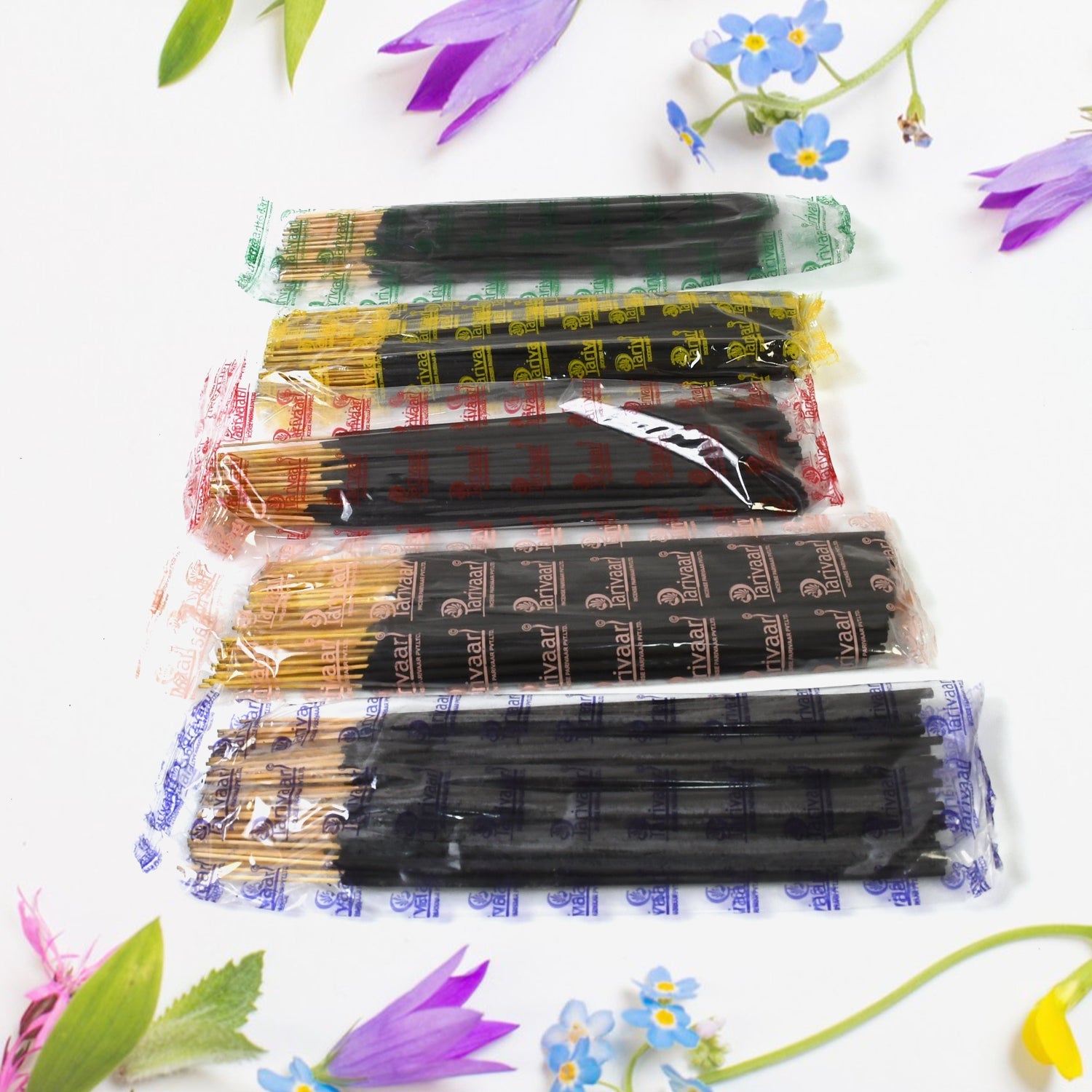 Lit Pancham incense stick releasing fragrant smoke, creating a calming atmosphere.