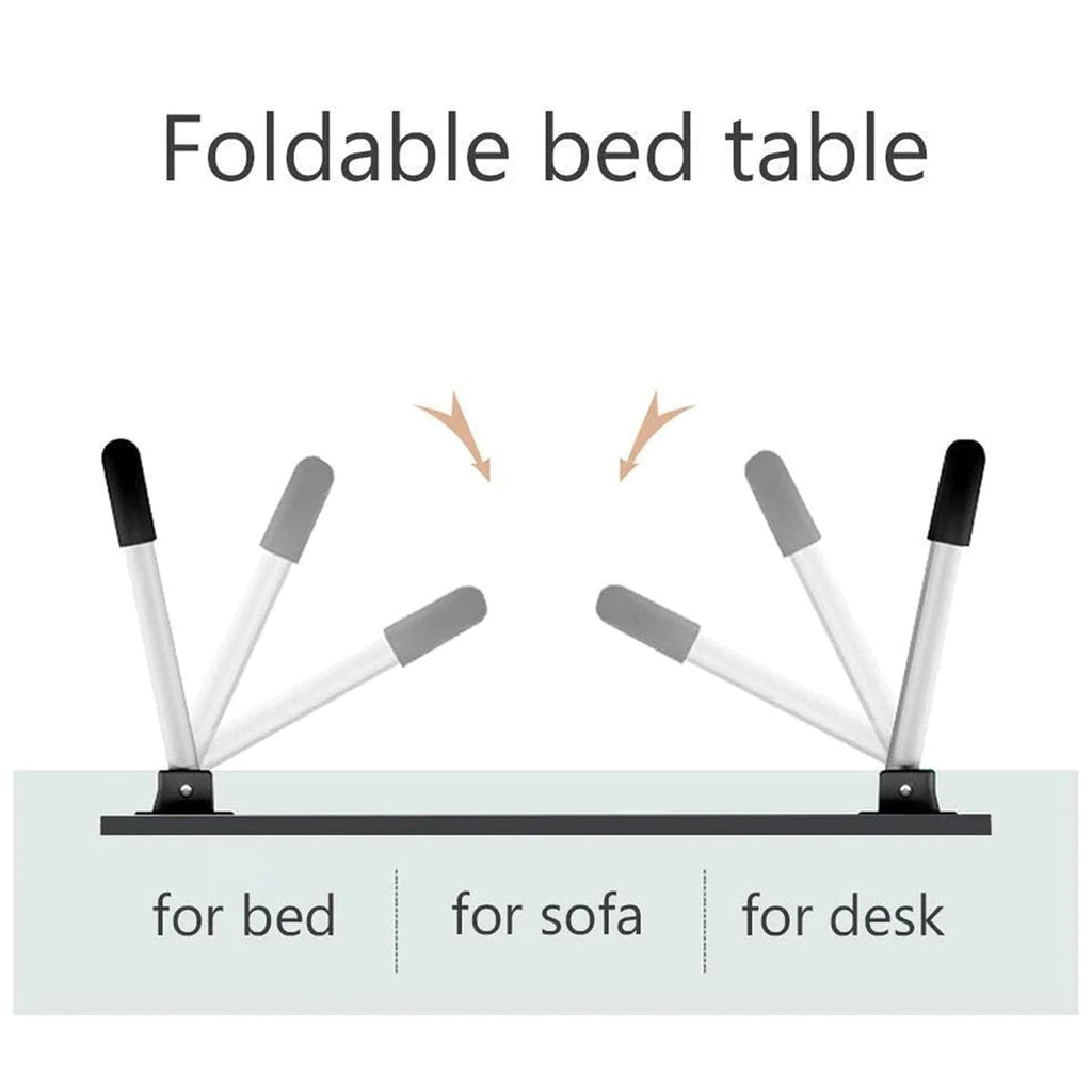 Individual using the portable bed desk for reading a book and taking notes in a relaxed setting.