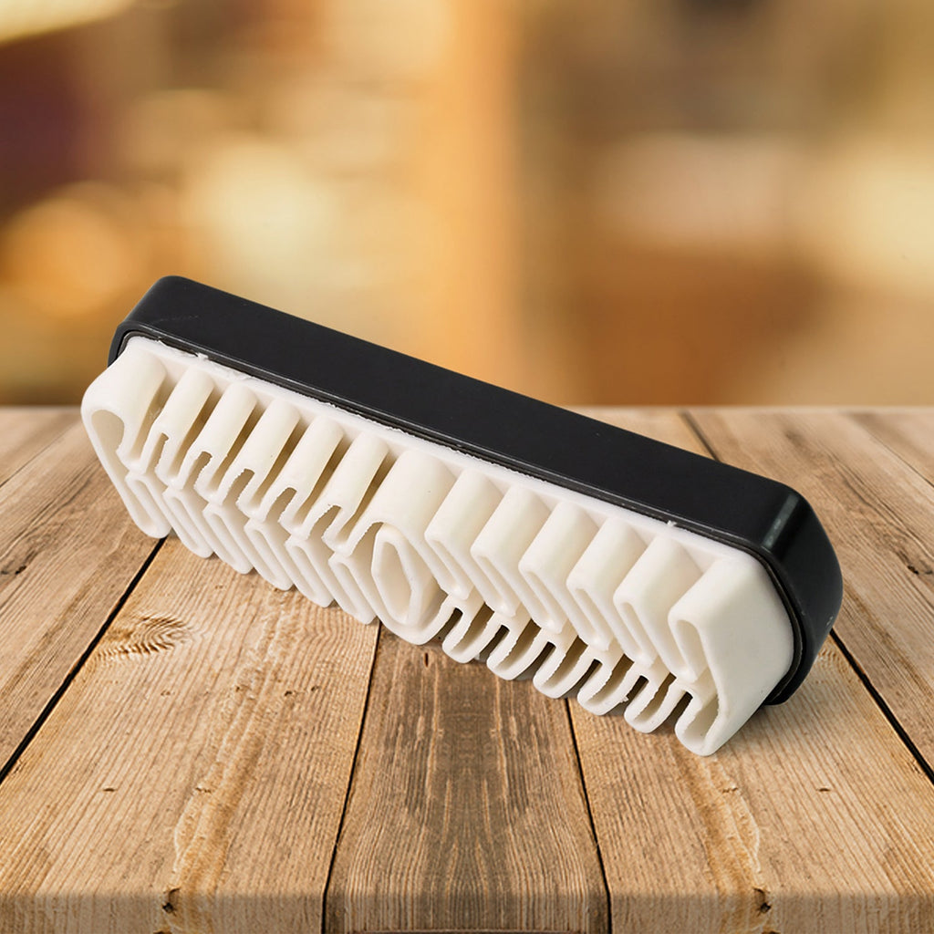 Rubber shoe cleaning brush showing textured surface