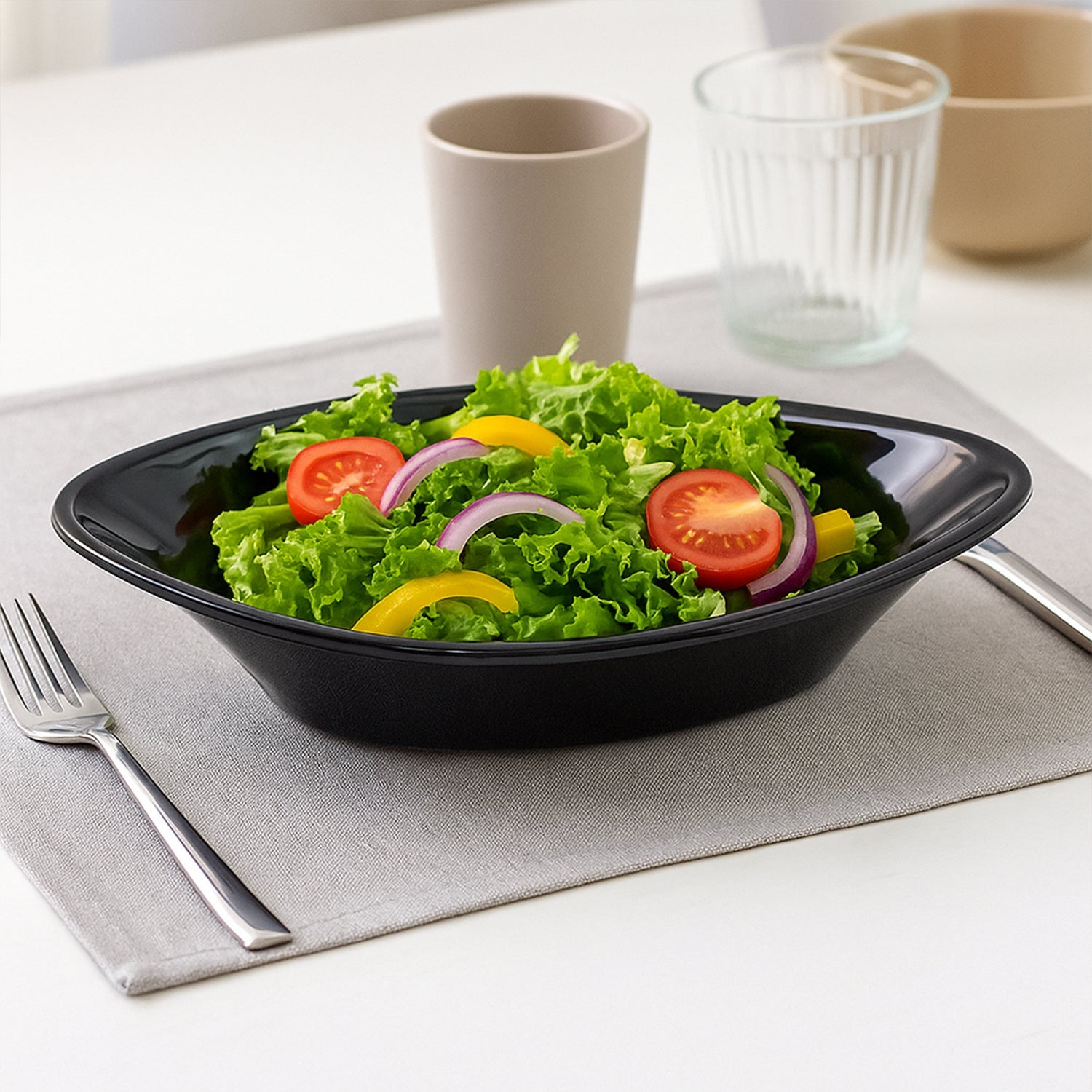 Oval black plastic serving bowl with a modern marin silhouette