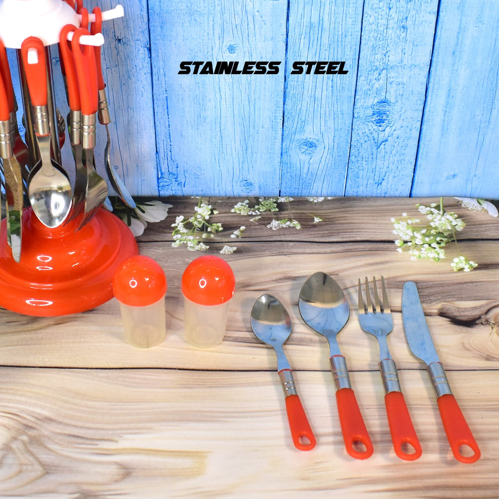 A hand holding a stainless steel dessert fork from the elegant 26-piece cutlery set, ready for dining.