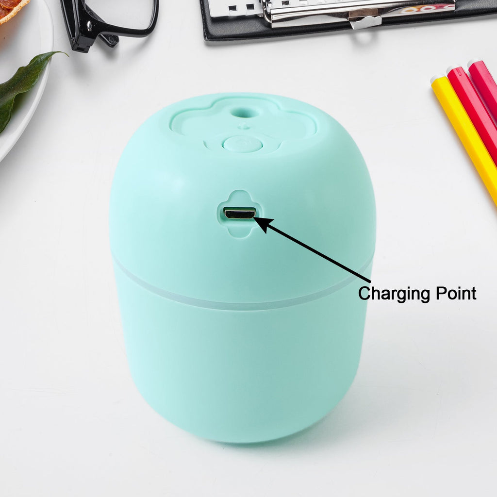 Mini USB Humidifier actively producing cool mist for improved air quality.