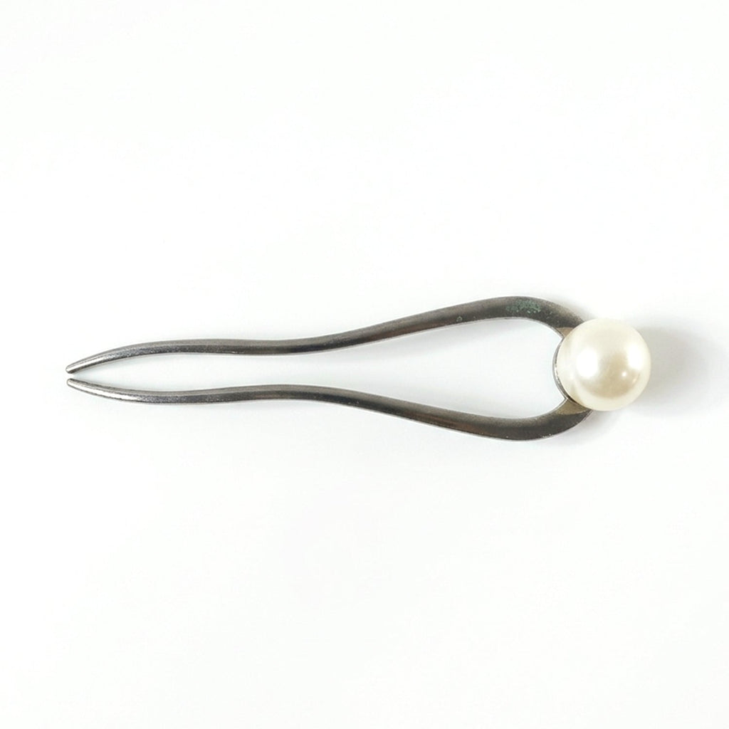 Close-up of pearl hair pin detail
