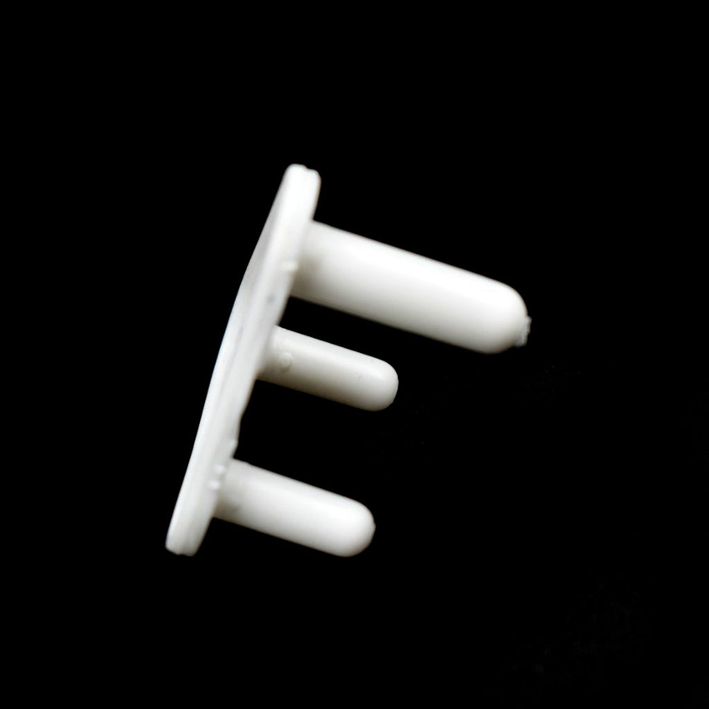 Pack of 100 white baby socket covers, essential for child safety in homes.