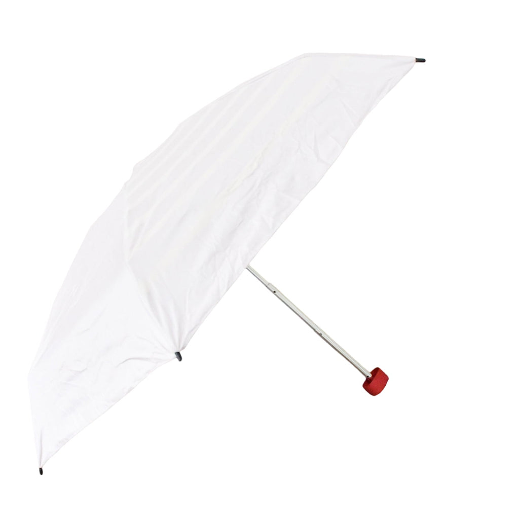 A white umbrella with a red handle is open and floating against a plain white background.