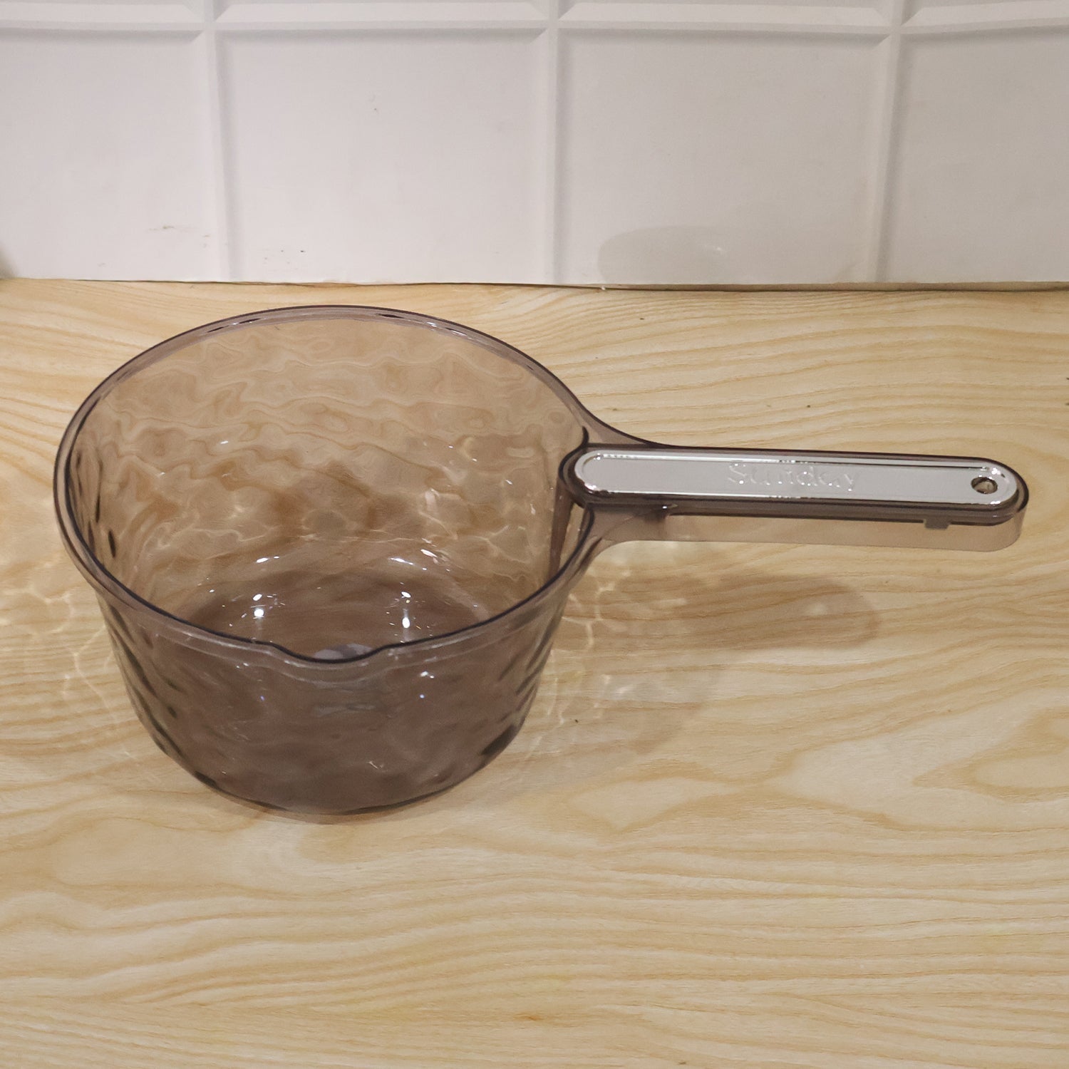 Daily household use of water dipper scoop for various tasks