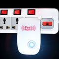 A white ultrasonic pest repeller with a blue indicator light is plugged into a white power strip with red switches.
