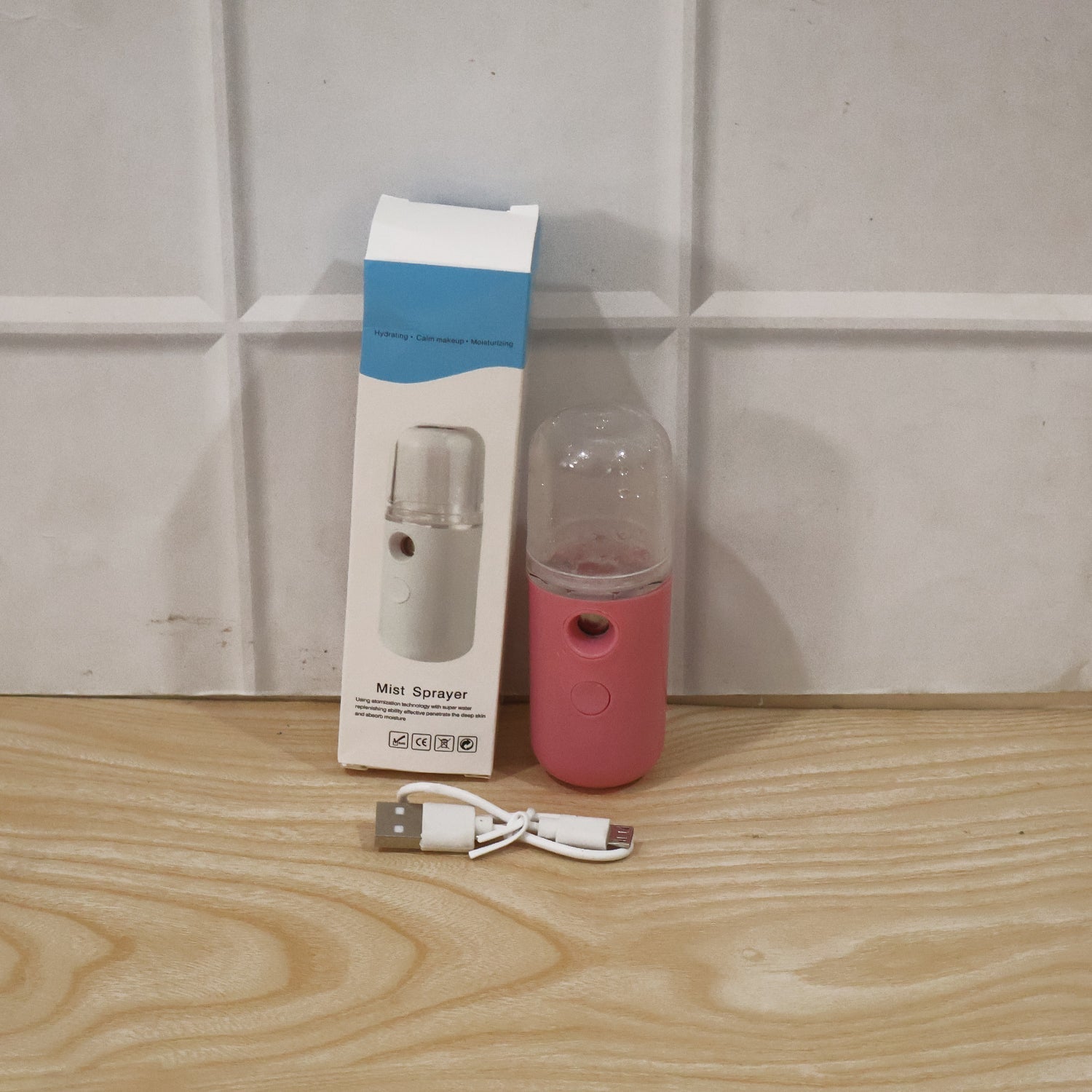 Woman using mist sprayer for daily skincare