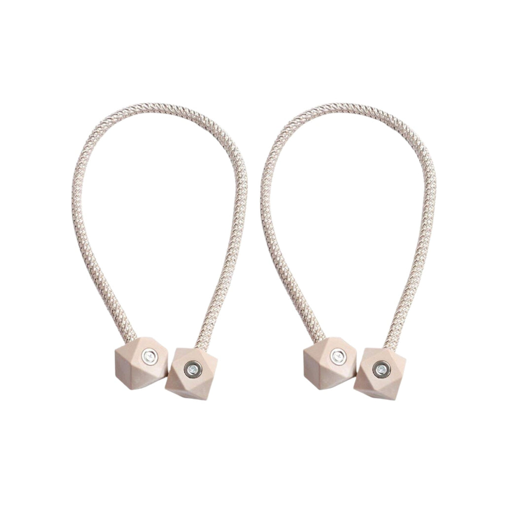 Non-magnetic pearl curtain tiebacks in use, adding a touch of elegance to living room decor.