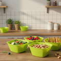A vibrant set of four square plastic serving bowls in various colours.