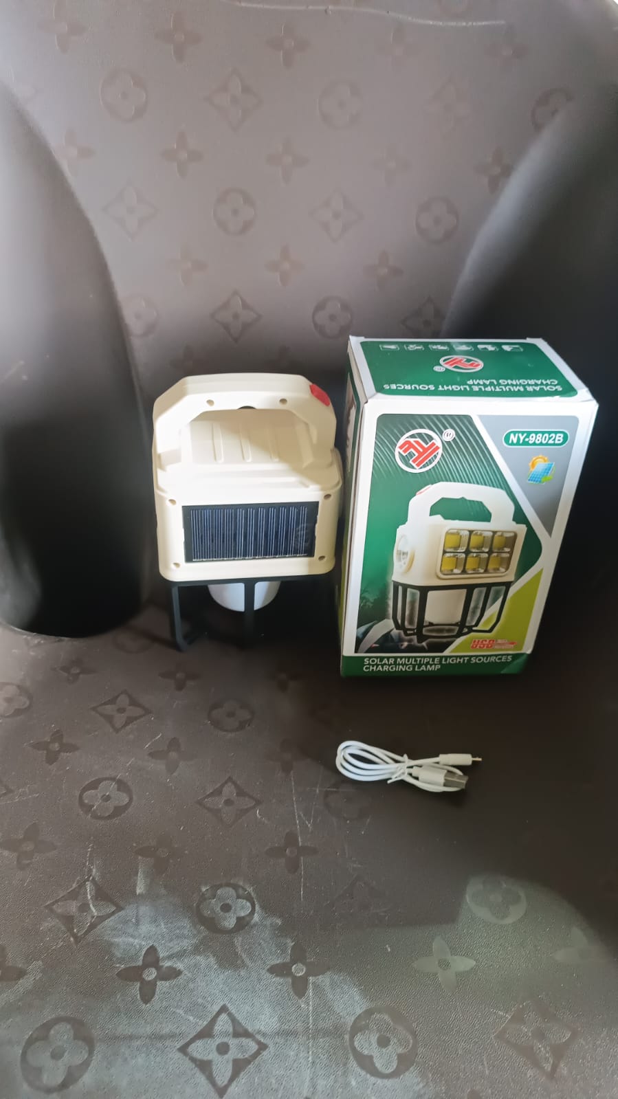 Camping lantern hanging inside a tent for indoor lighting