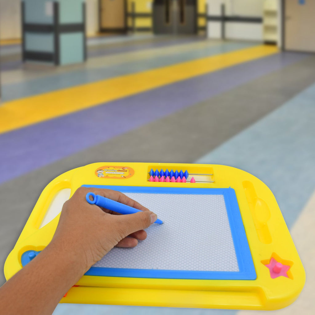 Top-down view of the Magic Sketch Slate with a colorful drawing and its integrated stylus pen.