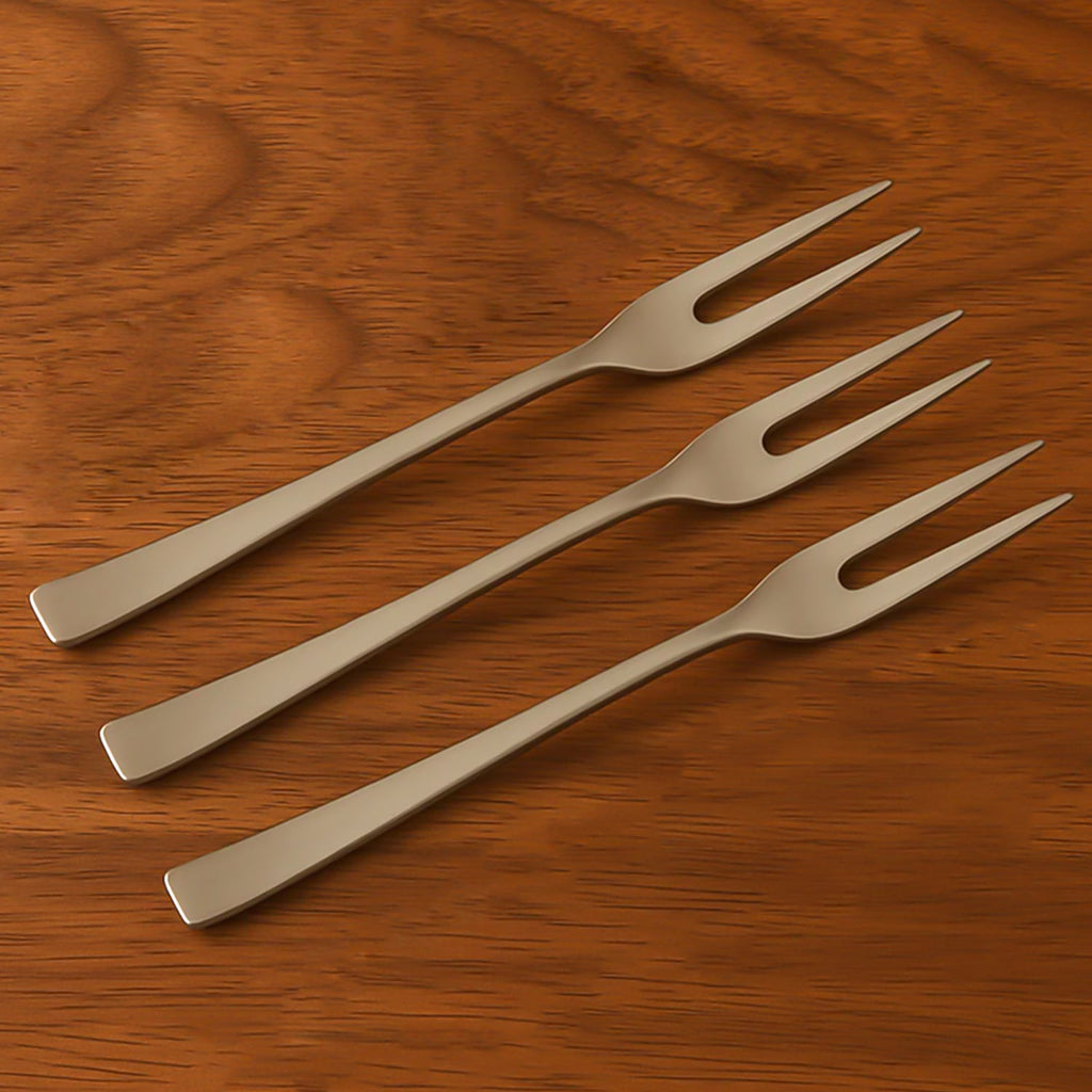 Single mini dessert fork ready for use on a table