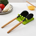 Multi-functional silicone spatula holder keeping kitchen utensils organized.