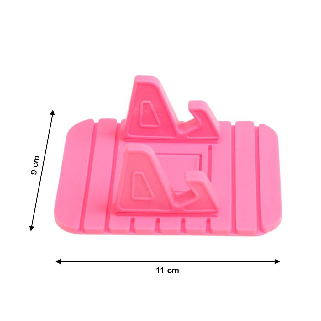 A sleek black Portable Mobile Stand holding a phone, used for following a recipe in the kitchen.