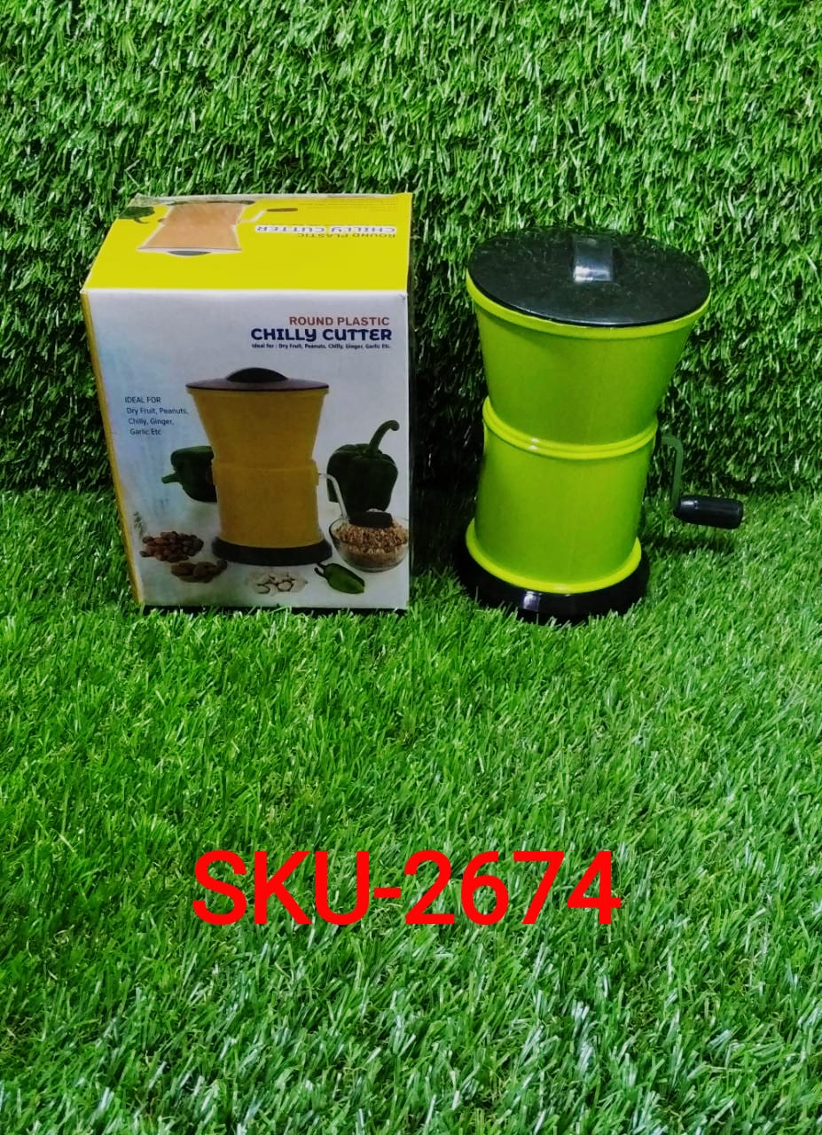 Ergonomic tool for cutting and grinding chilies, designed for easy kitchen use