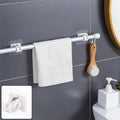 No-drill adhesive towel rod holder mounted in bathroom