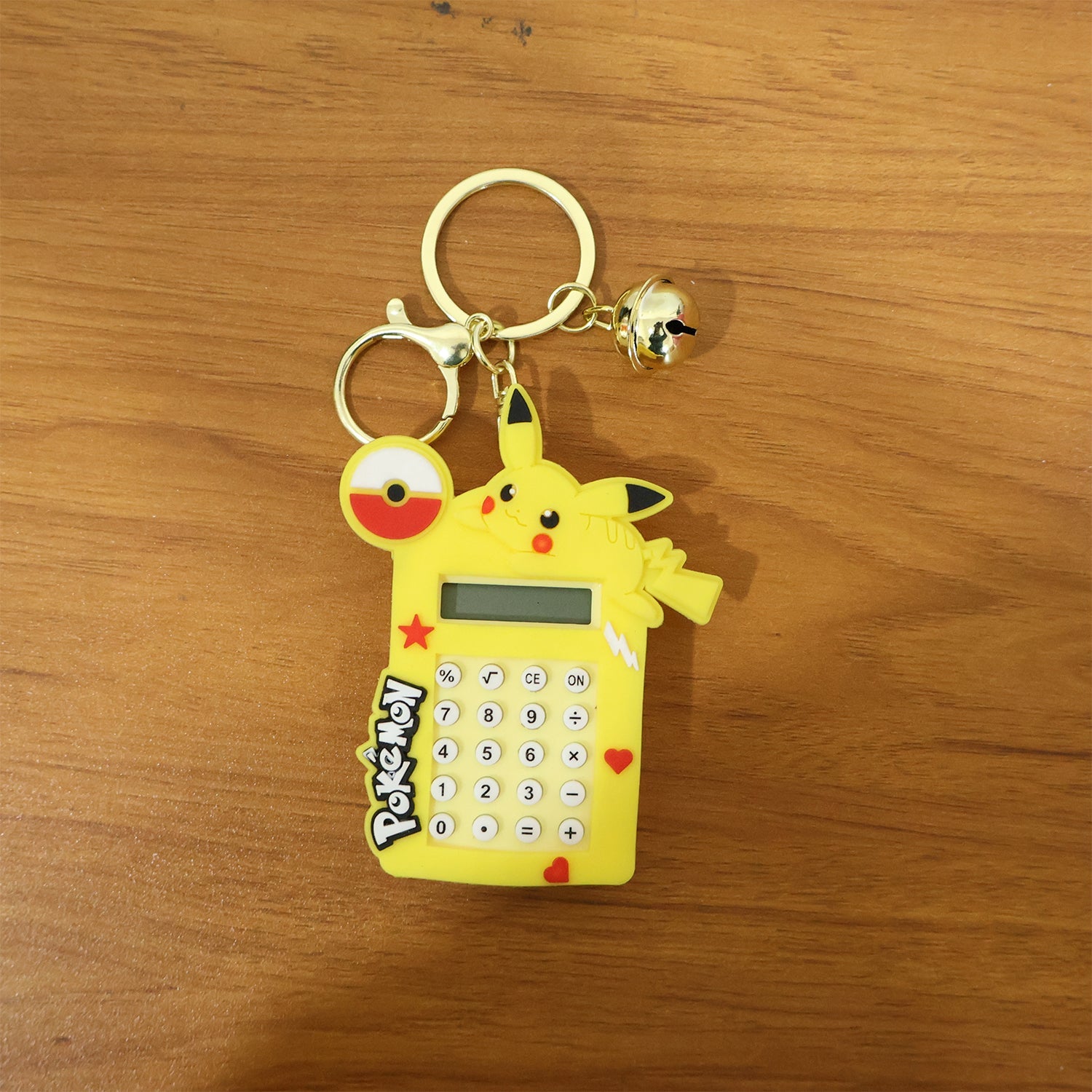 Calculator keychain with digital screen and bright yellow cartoon character design