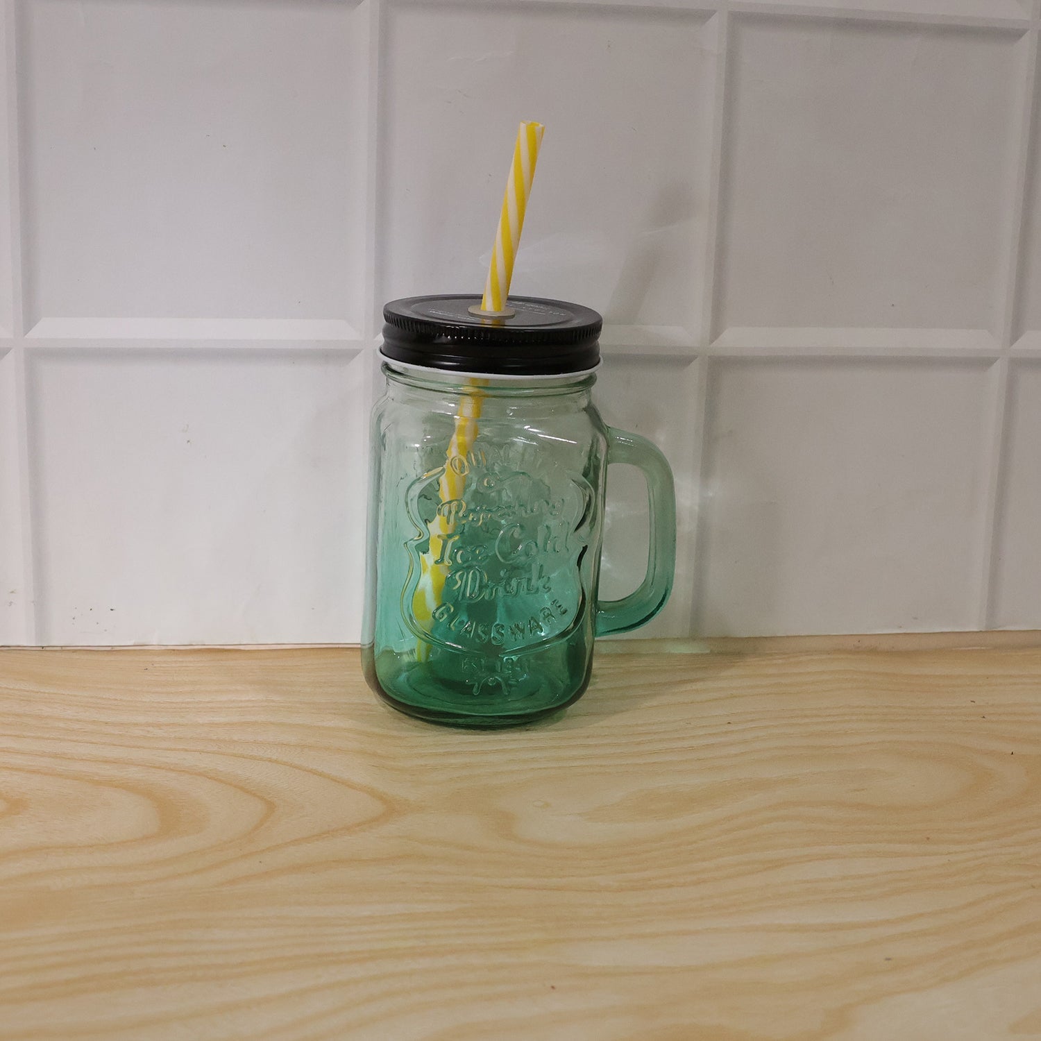 Mason Jar with Handle filled with a refreshing beverage, ready for enjoyment.