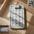 Portable inflatable bed folded for storage with easy carrying handle