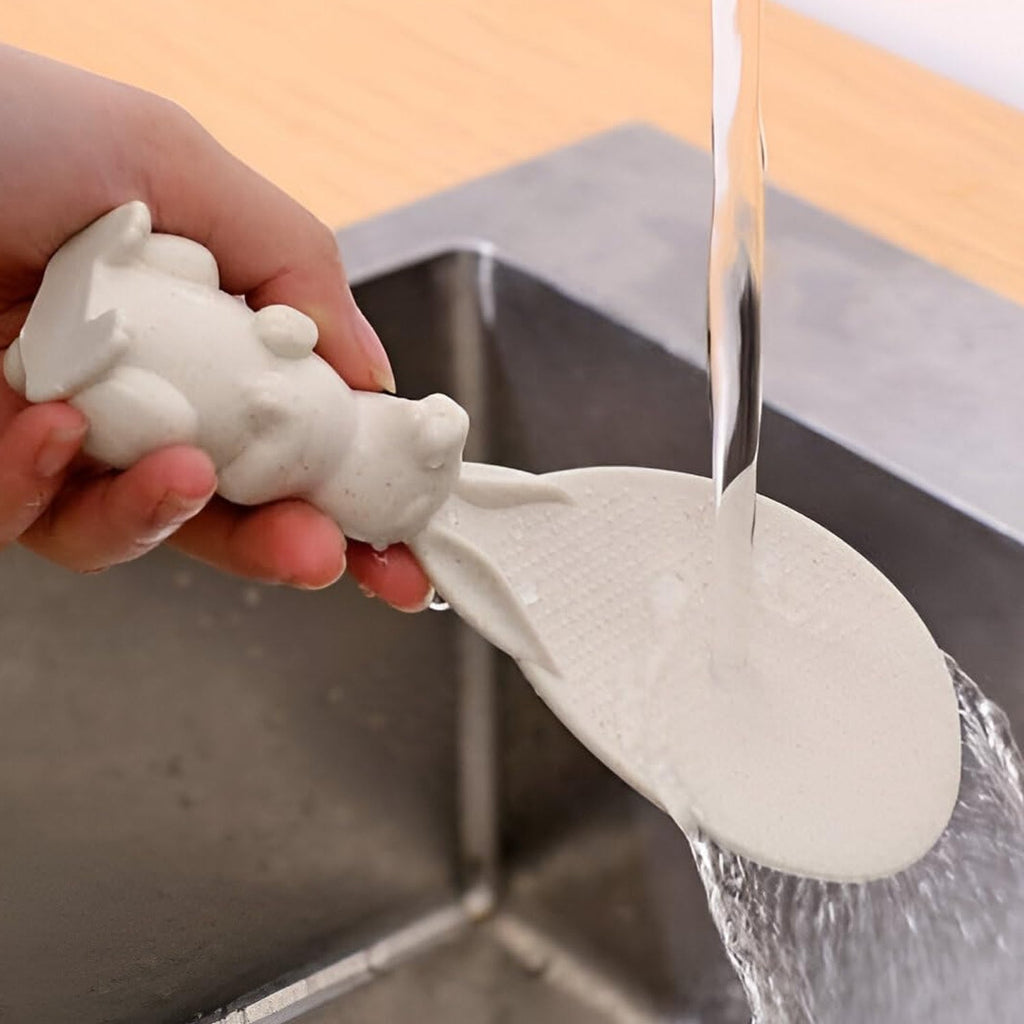 Angled view of rice serving spoon with bunny shaped handle