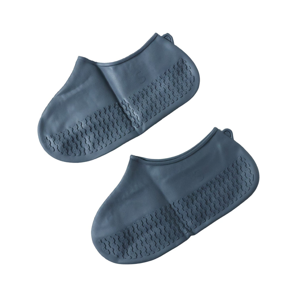 Two gray silicone foot protectors with textured soles are presented on a clean white background.