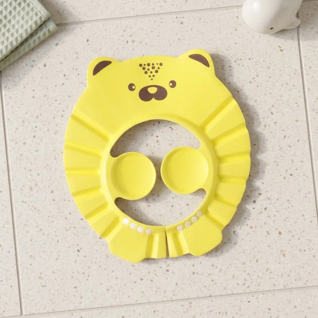 An infant wears a baby bath hair protection hat, made from soft waterproof material for gentle care.