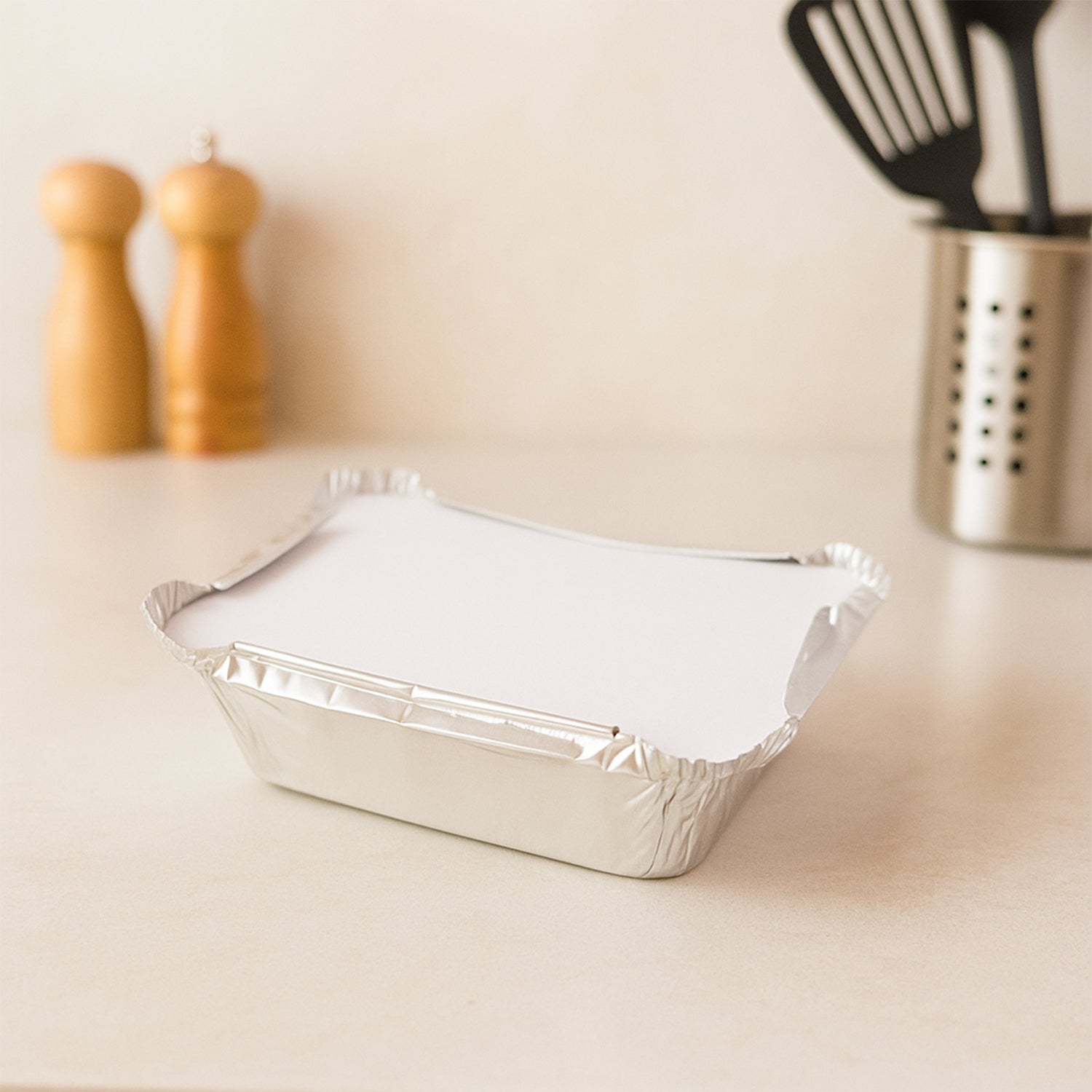 Close-up of lightweight aluminium disposable food container with secure lid