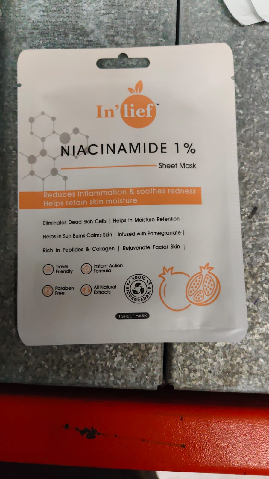 In’lief Niacinamide calming face mask displayed in a natural setting