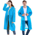 A man and woman model blue translucent rain jackets with hoods and white snap closures.
