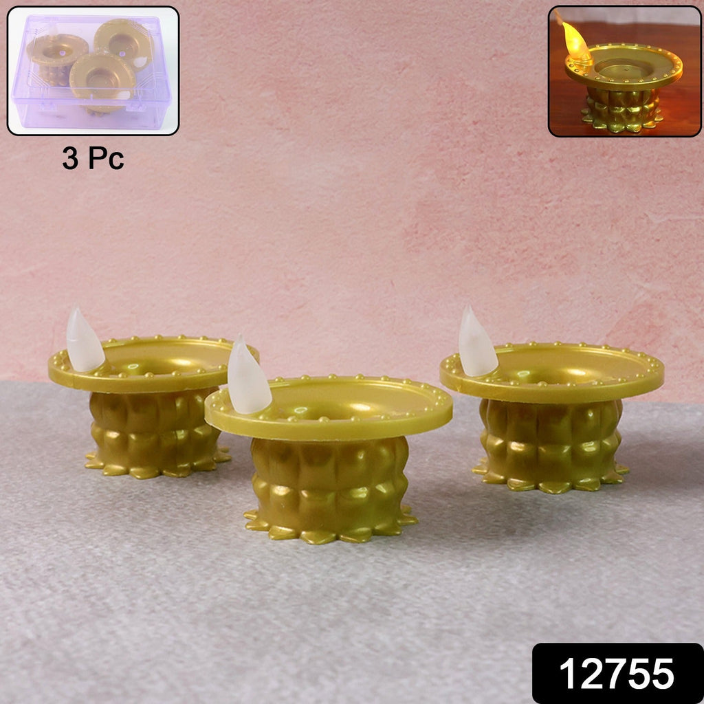 Golden water sensor LED diyas glowing in a decorative arrangement.