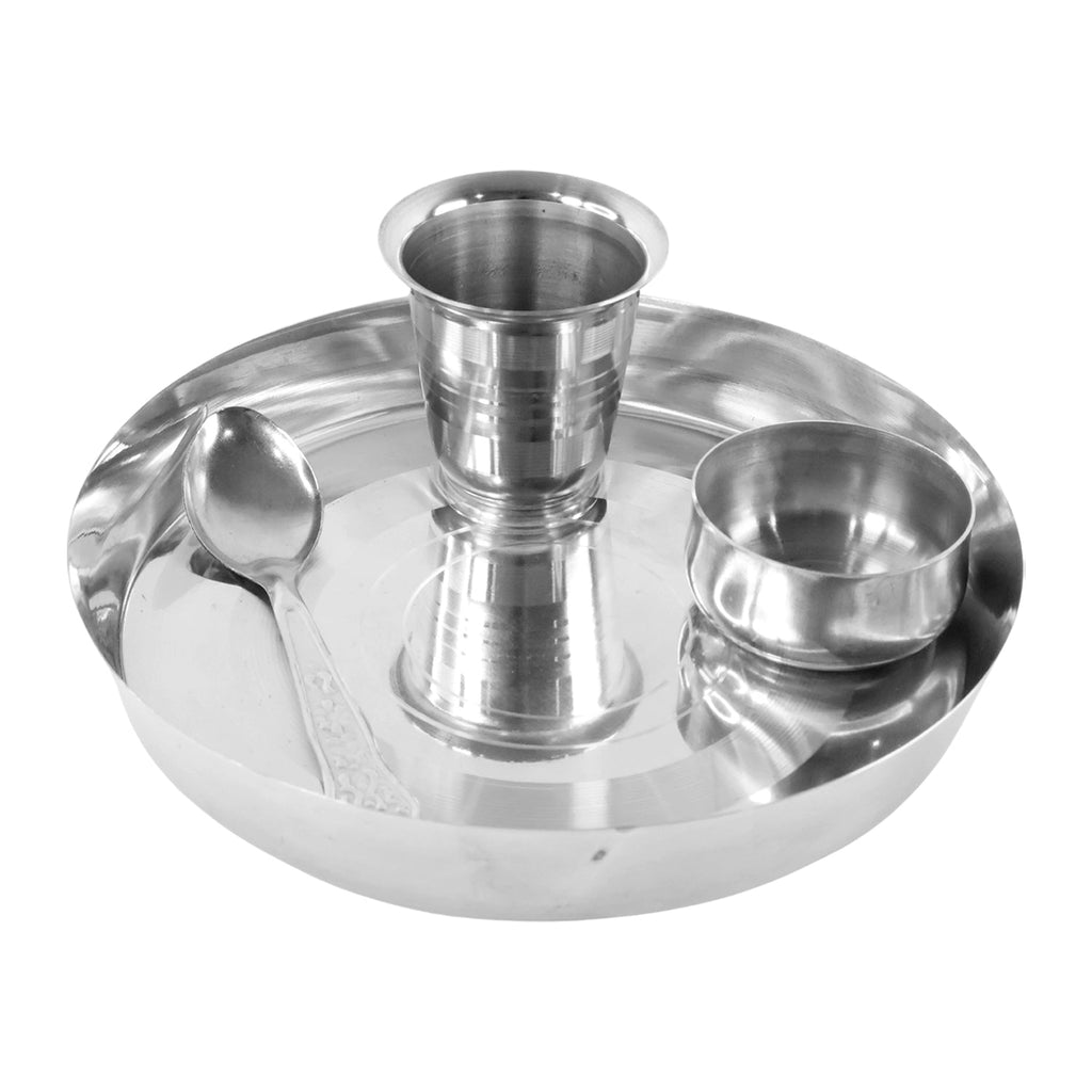 Components of the stainless steel thali set: plate, katori, glass, and spoon.