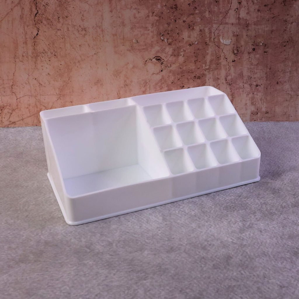Clear makeup organiser neatly placed on a modern vanity table setup.